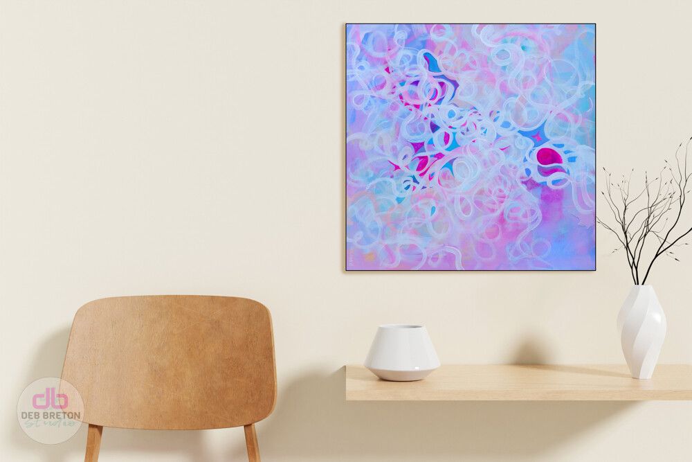 abstract painting hanging in living area